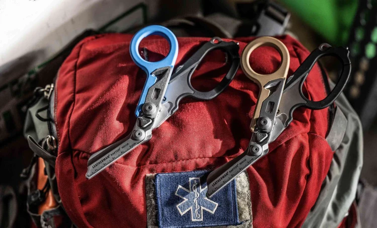 two_raptor_rescues_with_closed_shears_laying_on_top_of_a_backpack_20260402201735.webp